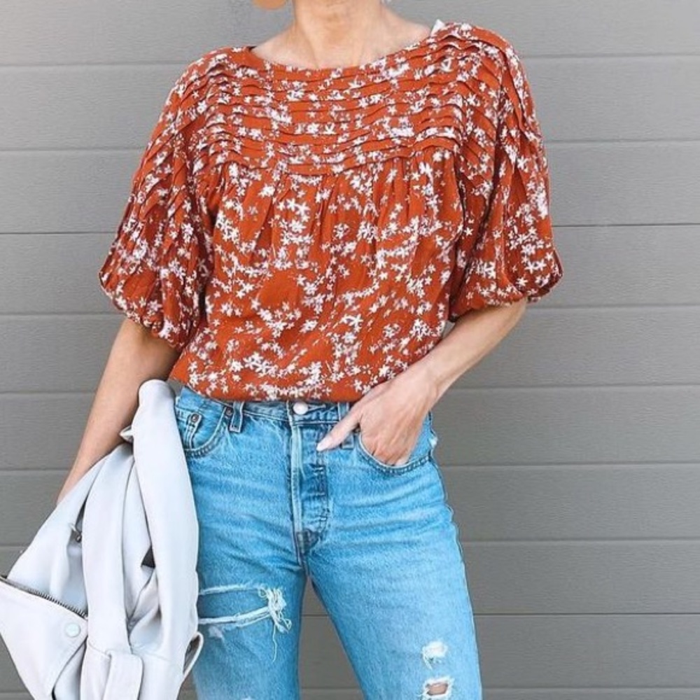 Free People orange floral bodysuit.